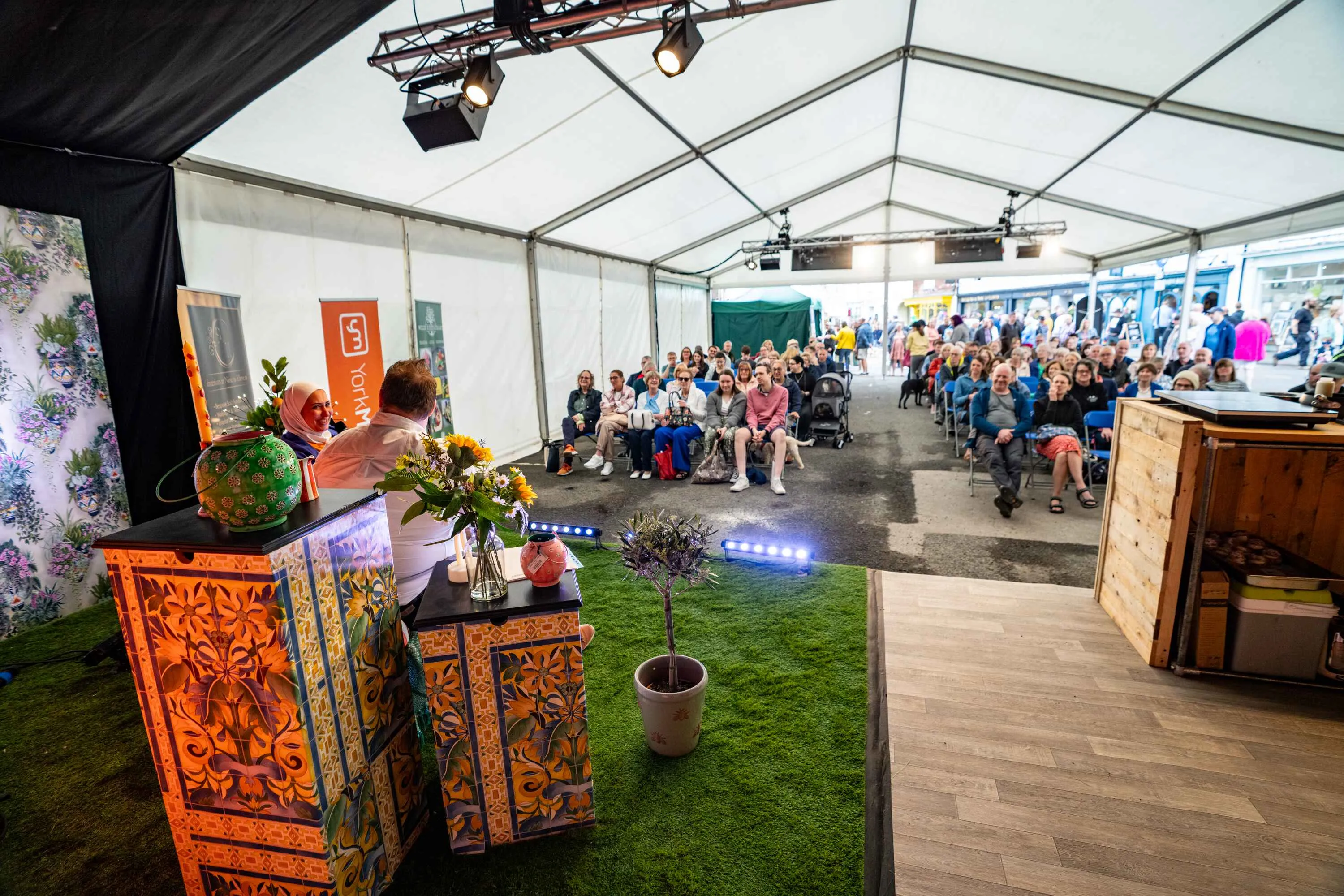 view through the cooking demo marquee with charis set out ready for the audience